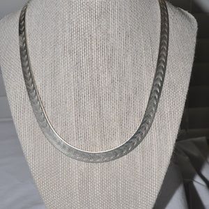 Sterling silver herringbone necklace.
